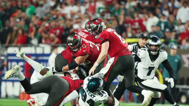 Josh Sweat and Haason Reddick close in on Baker Mayfield.